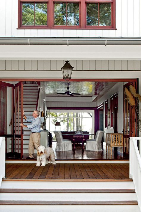 Patricia and Geordie Cole chose to reintroduce the dogtrot floor plan, originally developed centuries ago to accommodate the heat and humidity of the South, in their newly constructed South Carolina home. #dogtrothouse #lowcountryhouse #southernhomes #dreamhome #southernliving House Plans Southern Living, Wide Stairs, House Plans Southern, Dog Trot House Plans, Retractable Doors, Dog Trot House, Dining Outdoor, Wooden Porch, Front Steps