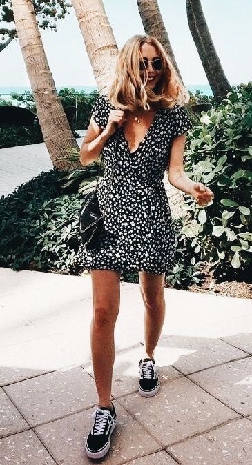 Pretty black and white print dress with black and white sneakers.