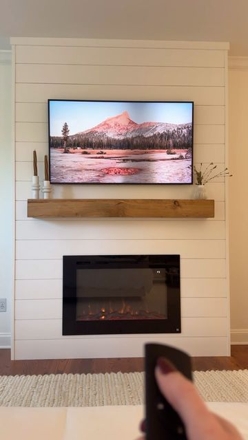 Carson Price Korenman on Instagram: "My husband came up with the idea to build a bump-out fireplace to elevate our master bedroom space… and I’m so proud of him for executing it perfectly 😍 we can’t wait to relax here as the weather gets cooler. While contractors have quoted a job like this at $3000-4000+, we spent around $1250 doing the work ourselves (this includes wood, shiplap, paint supplies, electric fireplace, mantle, and recessed TV mount - we used a frame TV we already own). The exact products we purchased are linked in my Amazon storefront (link in bio), or comment “LINKS” to get the info sent directly to you. 

Design plan inspired by @anawhiteplans 
.
.
.
#marriagegoals #diyhomedecor #diyfireplace #cozyseason #masterbedroomdesign #loweshomeimprovement #bedroomrenovation" Recessed Tv Mount, Building An Electric Fireplace, Shiplap Electric Fireplace, Recessed Tv, Wood Mantle Fireplace, Wood Shiplap, Electric Fireplace Mantle, Houston Houses, Fireplace Update