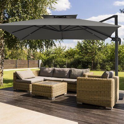 A shady retreat within walking distance from your back door? Get ready to build a patio that's ready to party with our cantilever umbrella! Stylish as it is, this umbrella is can stand up to natural damage that comes along with sunlight and rain. Caution and care: This umbrella can not stand alone. It must be secured with a weighted base (sold separately) or other weights (sandbags or bricks). We highly recommend a base (SKU: W007398554) for this heavy-duty umbrella. Fabric Color: Gray | Arlmont Build A Patio, Building A Patio, Cantilever Patio Umbrella, Offset Patio Umbrella, Offset Umbrella, Garden Umbrella, Canopy Design, Cantilever Umbrella, Outdoor Leisure