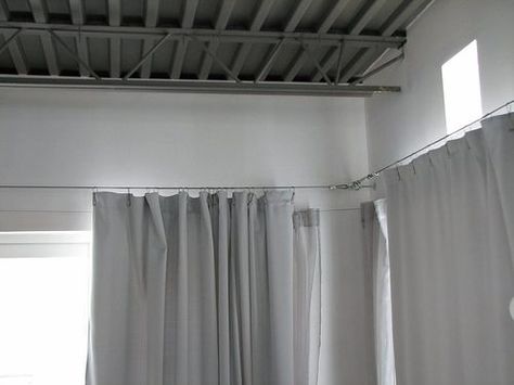 How to DIY your very own Ikea style custom curtain cable system. I love the Dignitet from Ikea, but it doesn't give you the versatility that making your own does. Perfect for sliders, arches, windows, canopy beds, kid's artwork displays.. the list goes on and on. Cover with a valance if you like the traditional look, leave exposed for a modern industrial feel. Industrial Loft House, Corner Window Treatments, Interior Design Secrets, Balcony Curtains, Bathroom Window Treatments, Balkon Decor, Tension Rods, Trendy Apartment, Ikea Curtains