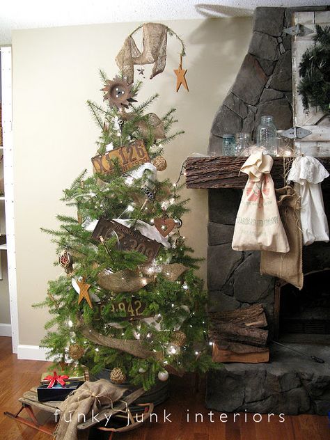 I love the old car tags and the entire rustic feel of this decor...including the bags hanging from the mantel in lieu of stockings. <3  Funky Junk Interiors: A Christmas like no other (2010 story) Funky Cottage, Canadian Christmas, Diy Schneemann, Primitive Country Christmas, Burlap Christmas Tree, Rustic Ideas, Winter Decorating, Christmas Cottage, Prim Christmas