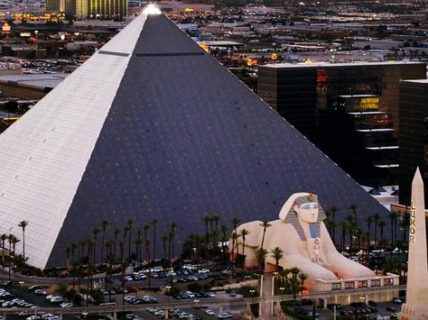 One of the most recognizable structures in Las Vegas, the Luxor Hotel stands majestically. The identifiable pyramid with its illuminating spotlight is one of the few manmade structures visible from space. Even more awe-inspiring sights await inside, with the world’s largest open atrium. Luxor Hotel Las Vegas, 9 Pointed Star, Luxor Las Vegas, Luxor Hotel, Hotels In Las Vegas, 60s Women, Las Vegas City, Vegas Hotel, Interesting Buildings