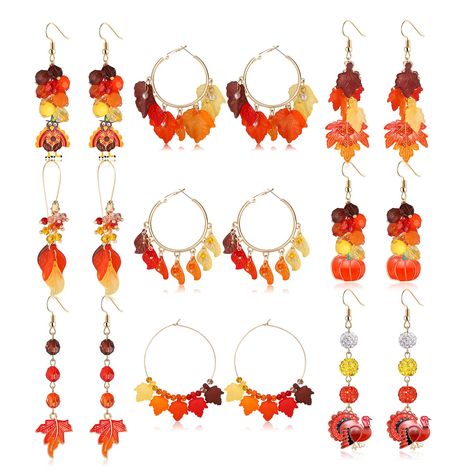 PRICES MAY VARY. Holiday Earrings for Women Variety Pack:9 pairs thanksgiving holiday themed dangling earrings including 3 pairs layer maple leaf long dangle earrings 3 pairs maple leave big round geometric hoop earrings and 3 pairs turkey pumpkin charms dangles earrings .So much styles and colors thanksgiving themed earrings bulk can matching your fall autumn outfits ,making you fashionable ,stylish , charming and more eye-catching in fall season . Hypoallergenic Thanksgiving Earrings :Fall has Diy Thanksgiving Earrings, Fall Handmade Jewelry, Thanksgiving Beaded Earrings, Fall Beaded Earrings, Fall Jewelry Ideas, Fall Beaded Jewelry, Thanksgiving Dinner Party Decor, Thanksgiving Earrings, Pumpkin Leaf