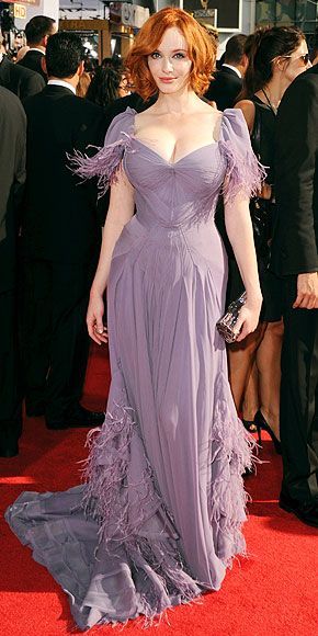 America's gone mad, mad, mad for 35-year-old actress Christina Hendricks - and her 1950s curves. The curvaceous "Mad Men" star was named Sexiest Woman Alive by Esquire, but she says fashion designers refuse to outfit her 5'8", size 20 frame. "I'm still struggling for someone to give me a darn plus size dress," she said before the 2010 Emmys. She eventually found a Zac Posen number and wowed the crowd. Auburn Hair Brown Eyes, Auburn Hair Brown, Cristina Hendricks, Zac Posen Gown, Redhead Fashion, Zac Posen Dress, Emmys Red Carpet, Purple Gown, Purple Gowns