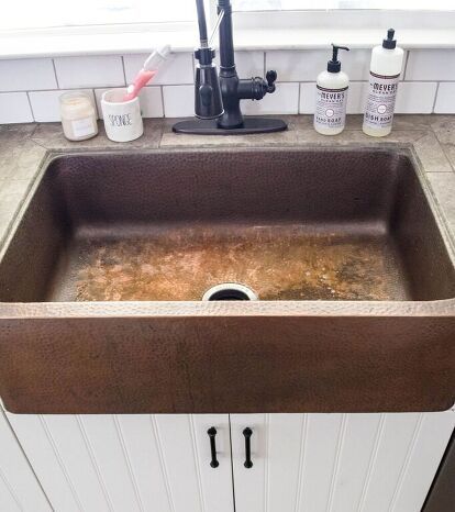 Cleaning your copper farmhouse sink is surprisingly easy and simple. For basic, every day, cleaning simply use a mild soap and water, that’s it! Nothing fancy no bleach or ajax here.For a deep clean you will need to use a copper cleaning kit. I use the same brand cleaning kit as my sink, which is Sinkology. The process is quick and easy! Clean Out Sink Start with an empty sink and you can either dry it or leave it wet for this. Fact: the items that make the copper change colors… How To Clean Copper Sink, Bathroom Light Fixtures Ceiling, Copper Farmhouse Sink, Remove Water Spots, Colored Sinks, Faux Fireplace Mantels, Fireplace Mantel Surrounds, How To Clean Copper, Copper Kitchen Sink