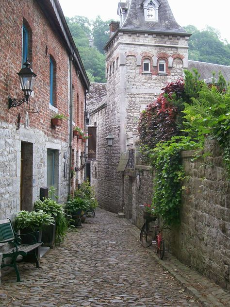 This back alley in Durbuy, Belgium was almost unrealistically charming.  Notice the old bicycle being used as a planter.  Belgian Ardennes. Well worth a visit. Belgian Countryside, Belgium Countryside, Ardennes Belgium, Winter In Belgium, Autumn In Belgium, Bluebell Forest Belgium, Old Bicycle, Belgium Travel, Quaint Village