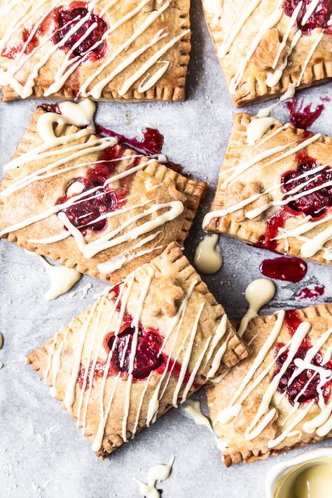 Home-made Raspberry White Chocolate Pop Tart Recipe will have you reminiscing about your childhood. Buttery shortcrust pastry filled with fresh raspberry jam and melted white chocolate will prove the easy treat you have been waiting for. By Emma Duckworth Bakes Homemade Pop Tarts Recipe, Pop Tarts Recipe, Chocolate Pop Tarts, Quick Sweets, Shortcrust Pastry Recipes, Poptart Recipe, Melted White Chocolate, Raspberry White Chocolate, Pies Recipes