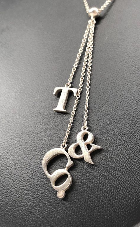 Sterling silver necklace with “T” “&” “Co.” pendants hung upon seperate chains Initials Necklace, Tiffany And Co Jewelry, Sterling Silver Necklace, Initial Necklace, Tiffany & Co., Sterling Silver Necklaces, Initials, Silver Necklace, Sterling Silver