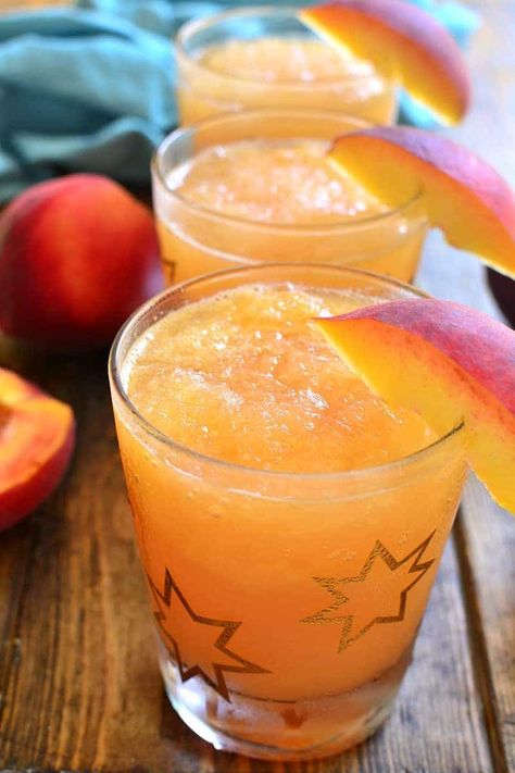 Frozen Peach Slush | | Lemon Tree Dwelling Peach Slush, Brandy Slush, Lemon Tree Dwelling, Slush Recipes, Summer Juice, Orange Juice Concentrate, Frozen Lemonade, Peach Schnapps, Peach Tea