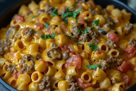 Introduction: If you’re a fan of bold flavors and hearty meals, then Cheesy Beef Taco Pasta is the perfect dish to add to your recipe repertoire. This delightful fusion of ... Learn More Cheesy Mexican Pasta, Cheesy Beef Taco Pasta, Cheesy Beef Pasta, Taco Pasta Casserole, Beef Taco Pasta, Mexican Thanksgiving, Easy Taco Pasta, Taco Pasta Recipe, Cheesy Taco Pasta