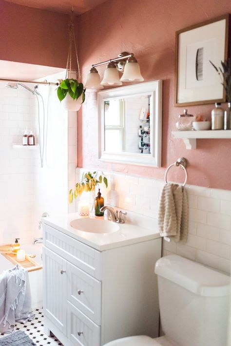 Parachute Bath linens are soft and absorbent. Terra-cotta peach walls with hanging plants and white tile make this the bathroom of our dreams. via Glitter Guide, photo by Kacey Gilpin Light Pink Half Bath, Pink Ceiling Bathroom, Peach Bathroom Walls, Painted Ceiling Bathroom, Pink Bathroom Walls, Peach Bathroom Ideas, Pink White Bathroom, Terra Cotta Bathroom, Pink And White Bathroom