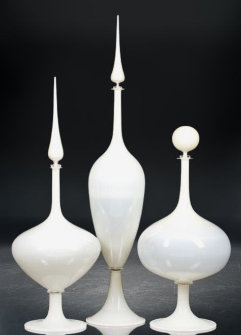 "Introducing the 'Timeless Elegance' set - a trio of exquisitely crafted , handmade white glass decanters with stoppers that embody classic vintage style. Each decanter in this set is a testament to the timeless beauty of artisanal craftsmanship, meticulously designed to exude sophistication and refinement. Crafted with care and precision, these handblown glass decanters showcase a pristine white hue that adds an air of grace to any setting. The stoppers, crafted with the same attention to detail, provide a perfect seal, preserving the rich aromas and flavors of your favorite spirits. This set of three decanters is not just a functional addition to your barware collection but a statement piece that effortlessly blends elegance with practicality. Whether adorning your home bar, dining table Bay Window Living Room, Classic Vintage Style, Organic Forms, Unique Vases, Money And Happiness, Glass Decanter, Decanters, Red Glass, Handmade Decorations