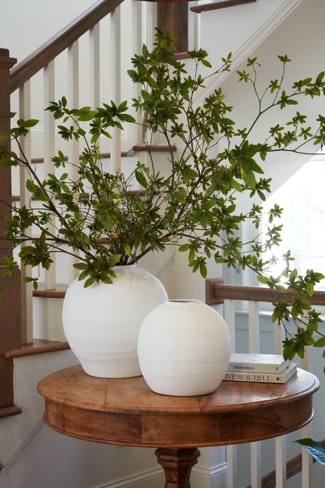 The Konos Vase is a round bellied cement vase in bright textural white. Its size and shape provide a perfect canvas for a large statement arrangement or a simple tropical stem. Weight: 17.8 lbs Dimensions: 14.50" x 14.50" x 14" Material: Concrete PLEASE NOTE: this item may drop ship from the vendor & have a longer transit time (7-10 days). if ordered as an in-store pick up, the same delay (7-10 days) may occur depending on inventory & availability. Styling With Vases, Large Round Vase Flower Arrangements, Floral Arrangements For Bathroom, Flowers Arrangements For Home, White Round Vase, Statement Arrangement, Round Foyer, White Vase Decor, White Sofa Living Room