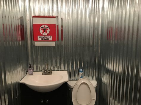 Corrugated metal wall with vintage Texaco paper towel dispenser. Small gas station bathroom. Gas Station Themed Room, Converted Gas Station, Gas Station Bathroom, Small Gas Station, Corrugated Metal Wall, Sheetz Gas Station, Texaco Vintage, Vintage Gas Station Air Pump, Paper Towel Dispenser