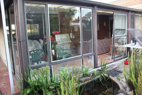 Our Budget Sunroom Makeover - & How to Spray Paint Aluminium Windows - House Nerd Old Sunroom Makeover, Metal Sunroom Makeover, Sunroom Makeover Before After, 70s Homes, Painting Metal Doors, Sunroom Kits, Sunroom Makeover, Windows House, Sunroom Remodel