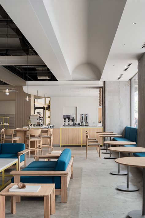 Japanese studio Keiji Ashizawa Design has created the interior of the Blue Bottle Coffee shop in Kobe's Hankyu department store. Keiji Ashizawa, Circular Ceiling Light, Blue Cafe, Blue Bottle Coffee, Floor Shelf, Low Coffee Table, Coffee Shops Interior, Built In Seating, Coffee Shop Design