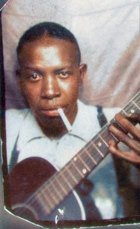 Robert Johnson sold his soul to the devil in Rosedale, Mississippi. This “photo-booth self-portrait” of Johnson, believed to have been taken in the early 1930s, is one of only two known photos of Johnson that have been made public. 60s Posters, Guitarist Art, Doc Watson, Baba Vanga, Sugar Ray Robinson, Robert Johnson, Blues Musicians, Delta Blues, Blues Artists