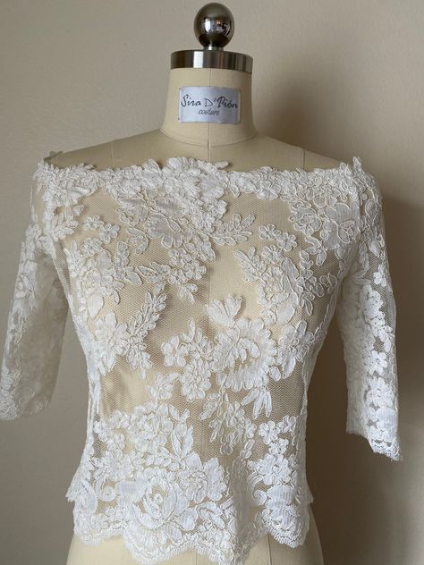 High quality materials, hand made lace top. French lace wedding dress top, relaxed fit, off the shoulder, satin covered buttons back closing. Re embroidery lace. Available in white and Ivory. At Sira D'Pion, all of our dresses can be customized to your specific needs and wants.  ▪️Measurements needed are: bust, waist, hips, length. Resizing options and shortening are available for an extra charge. Sizes are the standard in the bridal industry and we can help you in your size selection by submitt Bridal Skirt Separate, Wedding Dress Top, Wedding Tops, French Lace Wedding Dress, Bridal Crop Top, Wedding Dress Topper, Dress Topper, Bridal Wardrobe, Bridal Skirts