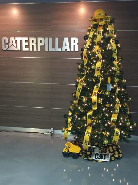 Construction themed Christmas tree at Caterpillar NLR Construction Theme Christmas Tree Ideas, Construction Christmas Decorations, Construction Christmas Tree Ideas, Construction Theme Christmas Tree, Construction Ornaments, Construction Christmas Tree, Industrial Christmas Tree, Themed Christmas Trees, Mesh Christmas Tree