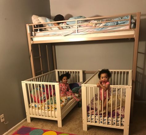 Needless to say we have a lot of kids (5 in total) so we are always trying to save space wherever we can. My husband and I recently decided to merge all the girls together in one room so we needed a way to fit all the beds in there. We purchased a metal loft bunk bed from Walmart, which sits up higher than a normal bunk bed. We then went to IKEA and bought two convertible cribs for our little ladies. The cribs fit perfectly underneath and still have a walk way for the two year old to get out. Bunk Beds With Crib Under, Loft Bed Crib Underneath, 3 Cribs In One Room Ideas, Crib And Bunkbed Shared Room, Bunk Beds And Crib Shared Room, Crib Under Loft Bed, 3 Toddlers Sharing Room, Crib Under Bunk Bed, Two Under Two Bedroom