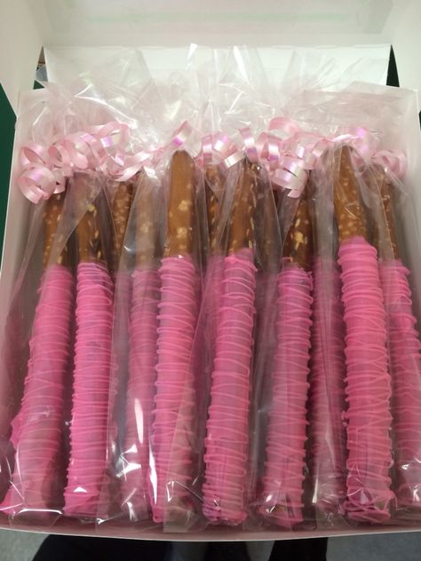 Pink dipped pretzels Pink Pretzels Sticks, Pink Dipped Pretzels, Pink Covered Pretzels, Pink Pretzels, Chocolate Pretzels Sticks, Chocolate Covered Pretzel Sticks, Pink Snacks, Pink Tea Party, Pretzel Sticks