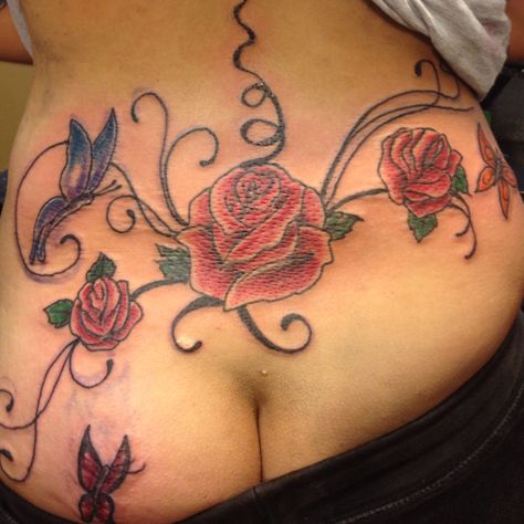 Roses lower back Lower Back Rose Tattoos For Women, Rose Lower Back Tattoo, Lower Back Flower Tattoo, Roses Tattoos, Lower Back Tattoo Designs, Buckle Bunny, Piercings Ideas, Rose Tattoos For Women, Black Femininity