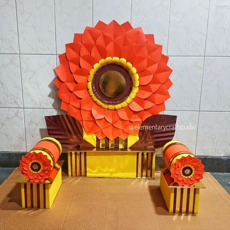 Orange Flower Makhar for Ganpati (Handcrafted/ Sustainable/Detachable/Easy to assemble) Suitable for 18" to 22" inch murti *Recommended for 20 inch murti.* Size: Back 32 inch height, diameter of flower 26 inch. Colour: Orange, Yellow, Brown and Golden. Materials used: Corrugated Boxboard, Coloured Paper, Golden Mirror Card Stock, White Glue and Paper tape. Set Includes: 2 loads, 2 load base, 1 backdrop flower with 2 leaves and 1 stand. "All parts are detachable & easy to assemble" Note onl... Ganapati Decorations, Chaturthi Decoration, Ganesh Decoration, Ganesh Chaturthi Decoration, Ganapati Decoration, Golden Mirror, Ganpati Decoration Design, Paper Craft Videos, Coloured Paper