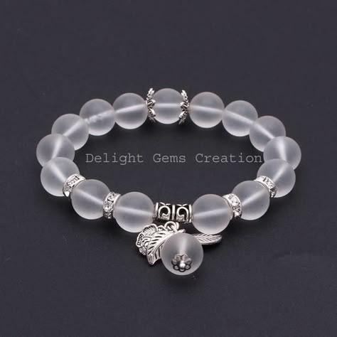 PRODUCT DETAIL :ITEM : WHITE CRYSTAL QUARTZ BEADED BRACELETITEM CODE :  DGC2387ITEM NAME :BRACELETGEMSTONE :  WHITE CRYSTAL QUARTZ BEADS SHAPE : ROUNDLENGTH :   8 INCH /STRETCHABLE BEADS SIZE:  12 MM ApproxWEIGHT :  180 Cts. APPROXCUSTOMIZATION/BULK ORDER : AVAILABLEPLEASE FEEL FREE TO CONTACT IF YOU REQUIRE ANY FURTHER INFORMATION. Halloween Beaded Jewelry, Shambala Bracelet, Mens Accessories Bracelet, Crystal Bead Jewelry, Round Bead Necklace, Bracelets Design, Beads Bracelet Design, Tassel Bracelet, Black Bead Necklace