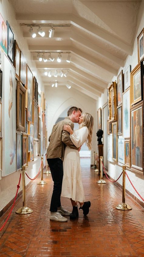 A couple poses for engagement photos in a local art museum Art Museum Engagement Photoshoot, Art Gallery Couples Photoshoot, Art Museum Couple Photoshoot, Engagement Photos Art Museum, Art Gallery Engagement Photos, Museum Couple Photoshoot, Engagement Photoshoot Ideas Unique, Museum Photoshoot Ideas, Art Museum Photoshoot