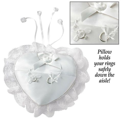 WHITE RING BEARER PILLOW HEART-SHAPED  Beautiful heart-shaped pillow is an elegant way for your special ring bearer to deliver the rings safely down the aisle.  The white satin heart has a lovely lace border and ribbons for securing the rings to the pillow.  A satin bow at the top along with rose details add the finishing touch.  The cover can be removed for hand washing.  Polyester.  9" L x 8" W x 2" D. ALL ITEMS ARE NEW & INSPECTED BEFORE SHIPPED! BRAND NEW!!!  LAST ONES!!! I ship immediately. Ring Bearer Pillow Lace, Rose Details, Ring Pillows, Flower Girl Baskets, Ring Bearer Pillows, Lace Ring, Ring Bearer Pillow, Collections Etc, Lace Heart