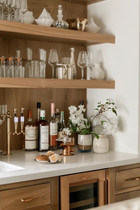 Discover stylish bar shelving ideas for home decoration. Turn your living space into a social hub with modern, industrial, and unique DIY designs using glass and wooden materials, elevating your hosting experience. Open Bar Shelving, Dry Bar In Living Room Ideas, Shelf Bar Ideas, Bar Shelf Ideas For Home, Floating Shelves Bar Area, Barware Display Ideas, Dry Bar With Floating Shelves, Bar Shelving Ideas, Bar In Living Room Ideas