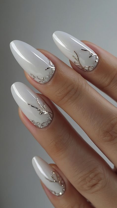 Discover stunning white nails with a milky design that's trendy and cute Get inspirations for black and blue pink and short red and milky pearl nail art ideas Perfect for your next nail design Simple Nail Designs Milky White, White Nails Ideas Winter, New Year White Nails, Pearl White Christmas Nails, Black Silver And Red Nails, Milky White Winter Nails, Winter White Nail Designs, Nails Milky White Design, White Christmas Acrylic Nails