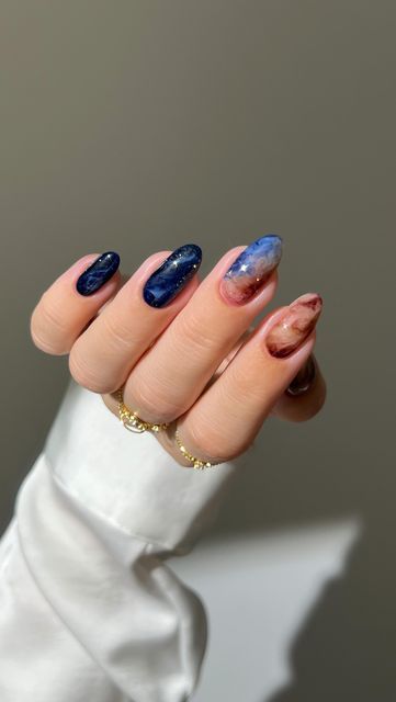 Aistė Haas on Instagram: "🌌🌒✨ bringing the beauty of the Universe, Jupiter and Europa to my nails ✨🛰️

Nail art celebrating @NASA @NASASolarSystem ‘s  mission to explore Jupiter’s icy moon, Europa, searching for clues about its potential to harbor life. Europa Clipper’s mission will bring us closer to answering one of humanity’s biggest questions: Are we alone in the universe? 

How exciting is that?!! 

_____
#RunwayToJupiter #galaxynails #bluenails #brownnails #marblenails #gradientnails  #glitternails #sparklynails #nailinspo #nails cute nails , almond nails , nail art tutorial," Jupiter Nails, Neptune Nails, Nasa Nails, Universe Nails, Galaxy Nails, Gradient Nails, Sparkly Nails, Brown Nails, Marble Nails