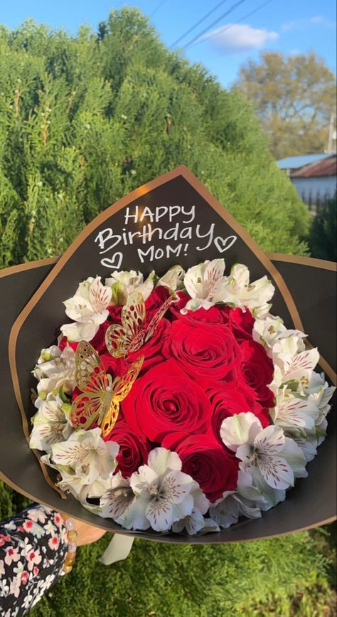 it’s a mothers birthday bouquet with one dozen red roses and covered all around with white flowers and wrapped with black and outlined gold wrapping paper and it has “ Happy Birthday Mom” as the letters Mom Birthday Flowers Gift Ideas, Ramos For Moms Birthday, Birthday Ramos For Mom, Flower Bouquet For Mom Birthday, Happy Birthday Ramo, Birthday Ramos, Birthday Ramo, Mom Bouquet, Ramo Ideas