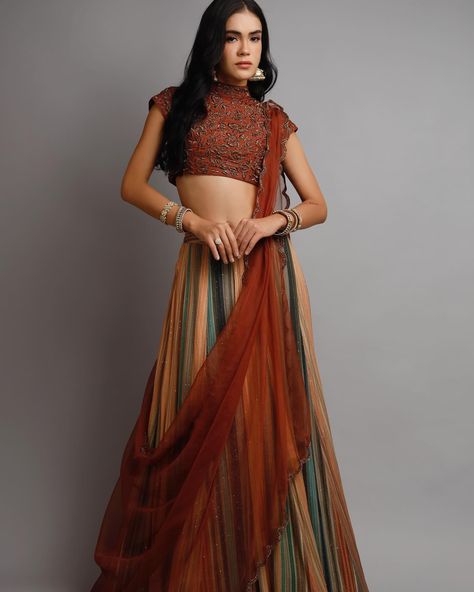 Rust elegance meets multicolour magnificence: Indulge in the fusion of traditional and contemporary flair with an exquisite rust with antique glass bead work blouse with Multi colour lehenga ensemble complete your look with the accompanying dupatta with sheer elegance. Order now!! For enquiry and whatazapp call +919911880993 We ship worldwide Model: @thamy_teles Make up: @pabitraraimakeup Jewellery: @suhana_art_and_jewels Photography: @7vik_studio #harshi#harshidesign#rustlehe... Multi Colour Lehenga, Bead Work Blouse, Antique Glass, Work Blouse, Glass Bead, Order Now, Lehenga, Bead Work, Glass Beads