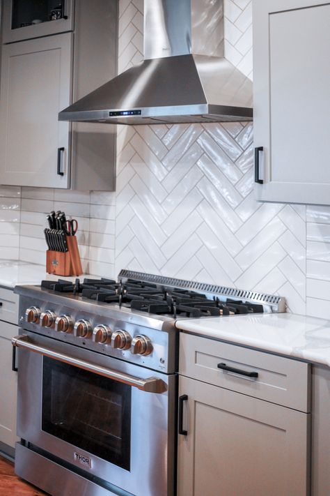 Herringbone Tile Behind Stove, Tile Behind Range, Accent Tile Behind Stove, White Herringbone Backsplash, Galley Kitchen Renovation, Kitchen Backsplash Tile Designs, Kitchen Confidential, Kitchen Decor Apartment, Herringbone Backsplash