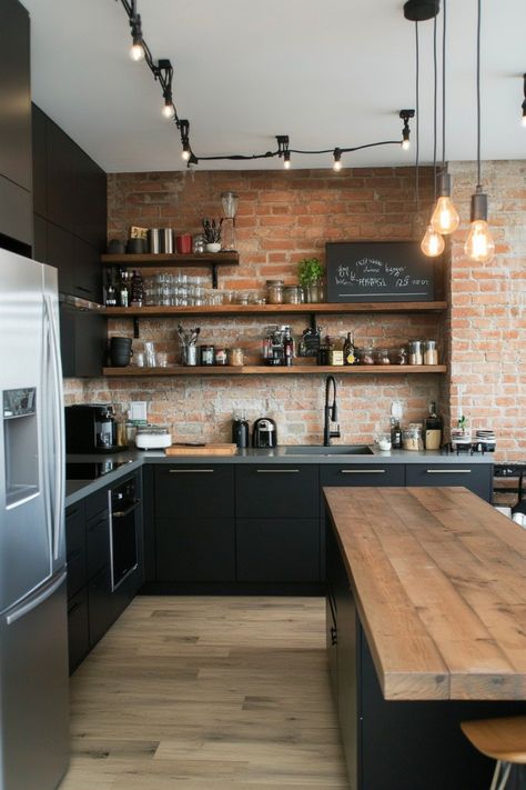 It is possible to create a black kitchen that is both stylish and inviting and these perfect examples will show you how! Black Open Shelving Kitchen, New York Style Kitchen, Industrial Design Kitchen, Townhome Kitchen, Industrial Modern Kitchen, Black Kitchen Shelves, Open Shelving In The Kitchen, Kitchen Shelf Design, Industrial Kitchen Shelves