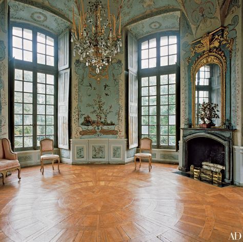 Hand-painted chinoiserie murals by Jean Pillement adorn the curved walls of the tower room in the Château de Haroué. The grand space in the 18th-century château, which was built in the Lorraine region by Germain Boffrand, “is the single room that represents all that is glorious about French design,” says decorator Timothy Corrigan. French Chateau Interiors, Chateau Interior, French Mansion, Chinoiserie Mural, Ad Architectural Digest, Chateaux Interiors, Chateau Style, French Castles, Castles Interior