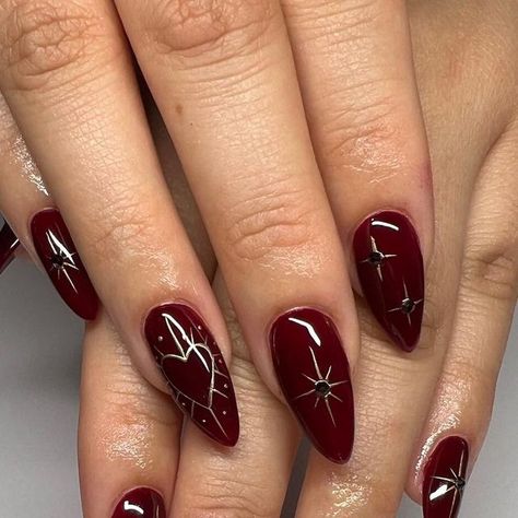 Shantal Saba on Instagram: "🍷✨ . . . .  #nails #nailsart #nailsdesign #nailinspo #nailideas #winternails #winternailart #christmasnails #christmasnailart #holidaynails #newyearsnails #chromenails #chromestarnails #darkrednails  #winerednails" Nails Inspiration For Christmas, Christmas Nail Designs Dark Red, Red Nails New Years Eve, New Year Theme Nails, Winter Solstice Nail Ideas, Moody Almond Nails, Hadestown Nails, Dark Red Fall Nails Design, January Aesthetic Nails