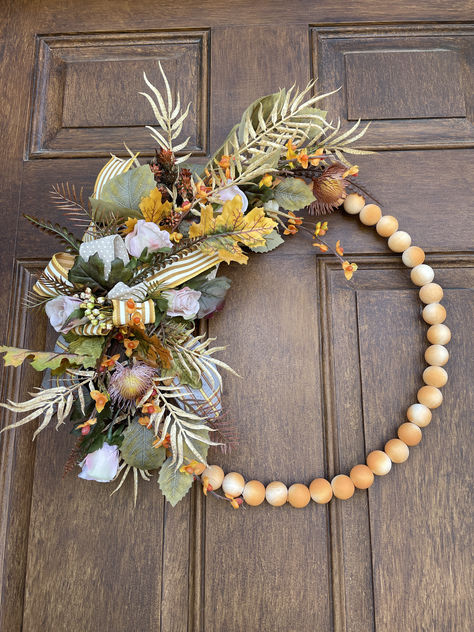 Bead wreath floral decor for the fall season adorns your front door as you welcome Thanksgiving guests to your home. Fall Bead Wreath, Bead Wreath, Fall Bead, Floral Designer, July 25, Silk Flower, Floral Decor, Fall Season, Silk Flowers