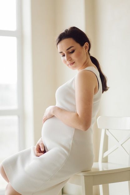 Woman Posing, Photo Beautiful, Pregnant Woman, Female Poses, Free Photo, Pregnant Women, Free Photos, Mother’s Day, High Neck Dress