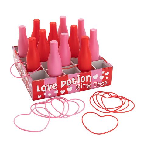 PRICES MAY VARY. Try your luck at love with this fun game! Players try to toss the heart-shaped rings onto the pink and red bottles to earn points. A fun and easy Valentine’s Day party activity, this is a game most kids already know how to play. This carnival-type game has plenty of pink, red and hearts, making it a great choice for Valentine’s Day or any event with love as the theme. Includes 12 plastic bottles and 12 rings. Cardboard. (25 pcs. per unit) Box, 32" x 32" x 4"; bottles, 2 1/2" x 9 Kids Valentines Games Ideas For School, Valentines Party Classroom, Valentine’s Day Games For Kids, Valentine’s Day Games, Valentines Games For Kids Classroom, Bottle Toss Game, Valentines Games For Adults, Valentines Carnival, Valentines Party Ideas For Kids