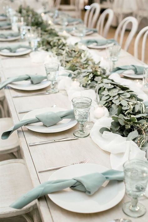 How beautiful is this muted seafoam green table setup?! The simple knotted napkins match perfectly with these gorgeous intricate goblets and the garland running down the middle of the table pulls it all together. #receptiontableideas #weddingreception #weddingtable Knotted Napkins, Seafoam Green Wedding, Green Wedding Reception, Seafoam Wedding, Sea Glass Wedding, Wedding Table Setup, San Luis Obispo Wedding, Green Themed Wedding, Green Napkins