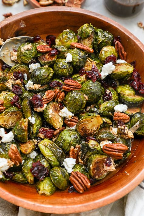 Flavor packed & ready in less than 30 minutes! Tender roasted brussel sprouts are mixed with tart cranberries & creamy goat cheese then tossed in a sweetened maple-balsamic glaze & topped with crunchy pecans. These maple-balsamic roasted brussel sprouts are a simple yet impressive side dish perfect for any occasion! Ambitious Kitchen Brussel Sprouts Salad, Roasted Fall Veggies Thanksgiving, Autumn Brussel Sprouts, Thanksgiving Brussel Sprout Salad Recipes, Roasted Brussel Sprouts Cranberries, Brussel Sprout Recipe Thanksgiving, Brussel Sprouts Thanksgiving Recipes, Healthy Fall Dishes, Brussel Sprouts Side Dishes