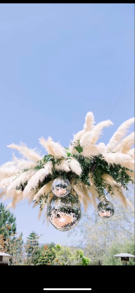 DIY overhead dance floor installation. Disco Balls And Pampas, Disco Pampas, Disco Ball Outdoor, Ceiling Display, Coachella Theme, Reception Ceiling, Diy Disco Ball, Disco Ball Decorations, Disco Ball Decor