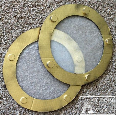 Cardboard Ship Wheel & Fake Portholes                                                                                                                                                                                 More Diy Pirate Ship Wheel, Yacht Rock Party Decor, Cardboard Pirate Ship Diy, Pirate Props Diy, Cardboard Waves, Pirate Ships Diy, Cardboard Ship, Pirate Ship Wheel, Cruise Ship Party