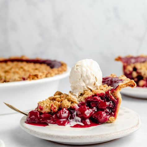 Gorgeous dutch tart cherry pie with a wonderful, golden crumb topping. This homemade tart cherry pie recipe has a perfectly sweet filling with hints of amaretto and is absolutely delicious served with a scoop of ice cream. This will be your new favorite cherry pie recipe! #cherrypie #pierecipe #thanksgiving #baking Tart Cherry Pie Recipe, Tart Cherry Pie, Cherry Recipes Dessert, Thanksgiving Baking, Cherry Pie Recipe, Slice Of Pie, Berry Crumble, Slab Pie, Ambitious Kitchen