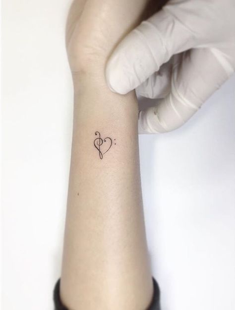 Bass Clef Heart Tattoo, Over The Heart Tattoos For Women, Treble Clef Bass Clef Tattoo, Bass Clef Treble Clef Heart Tattoo, Treble Clef And Bass Clef Tattoo, Small Bass Tattoo, Treble And Bass Clef Heart, Small Tattoo Ideas Music, Music Heart Tattoo Designs