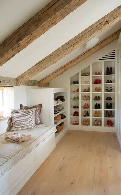 Picture of a small yet cozy attic space with a windowsill daybed and built in shoe shelves and clothes shelves is a very cool idea Finished Attic Closet, Built In Shoe Shelves, Attic Built Ins, Attic Storage Shelves, Attic Closet Ideas, Makeshift Closet, Neutral Kitchen Designs, Attic Nook, Cool Chandeliers